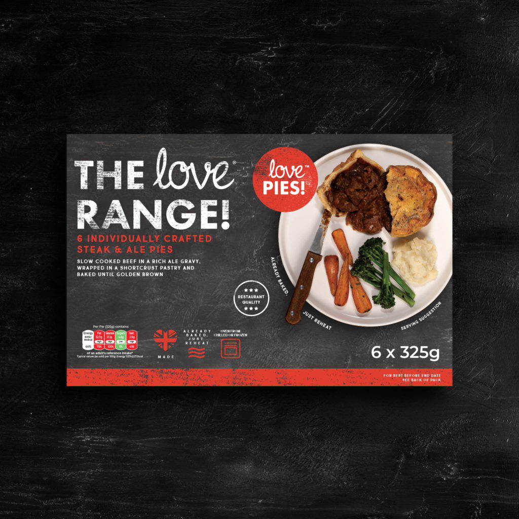 A box of Love Pies in Steak and Ale flavour sat on a slate background
