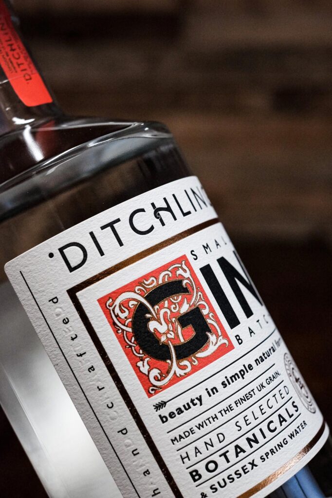 Bottle of Ditchling gin being held at an angle