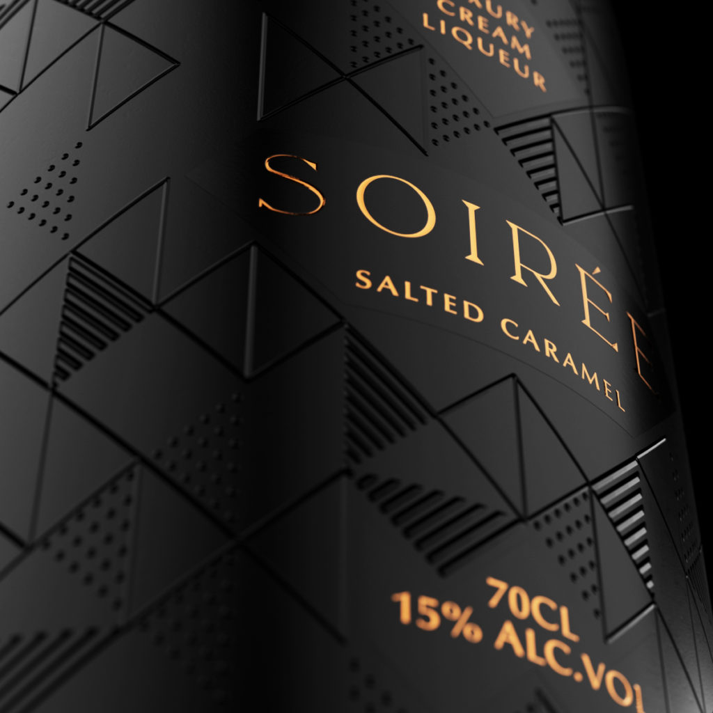 A close up image of a bottle with a geometric embossed pattern and copper/gold product name, Soiree